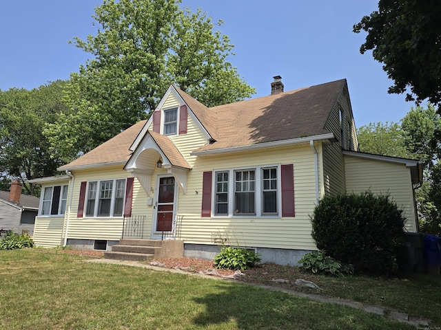 48 Scott St, East Hartford, CT 06118 - view of front facade featuring a chimney, a front yard, and a shingled roof