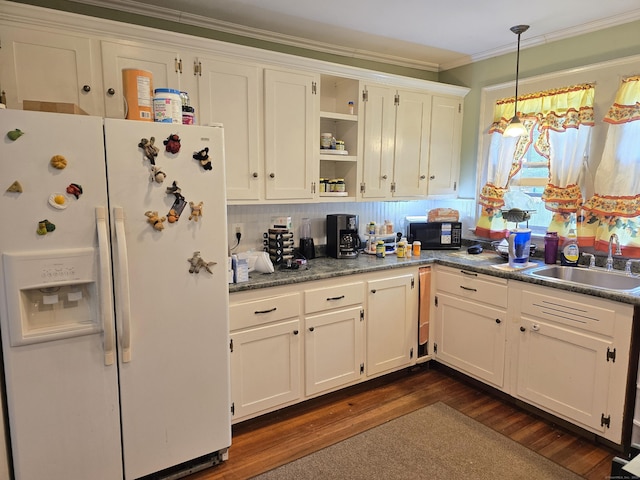 48 Scott St, East Hartford, CT 06118 - kitchen featuring white refrigerator with ice dispenser, black microwave, open shelves, ornamental molding, and white cabinets