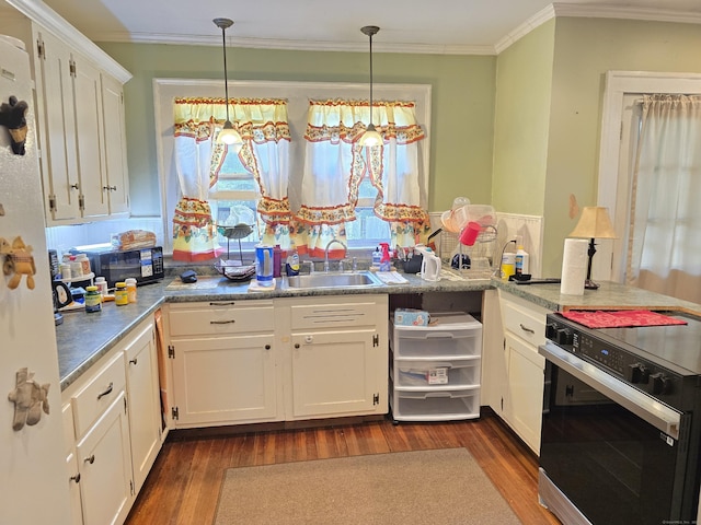 48 Scott St, East Hartford, CT 06118 - kitchen featuring stove, black microwave, dark wood-style floors, ornamental molding, and white cabinetry