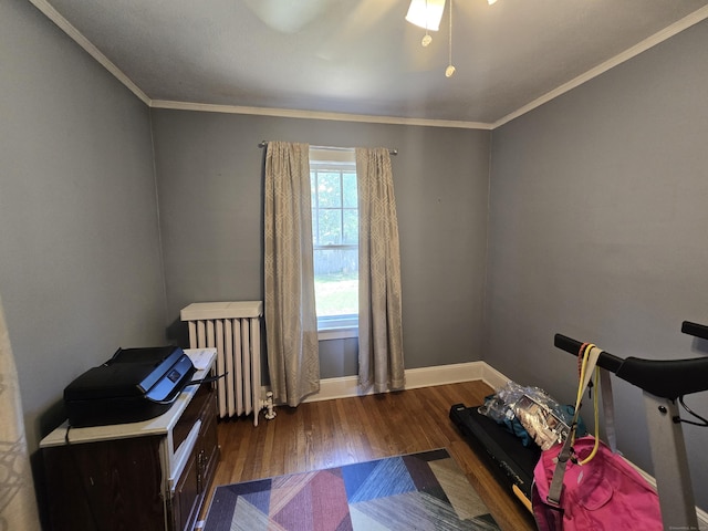 48 Scott St, East Hartford, CT 06118 - bedroom featuring radiator heating unit, wood finished floors, and ornamental molding