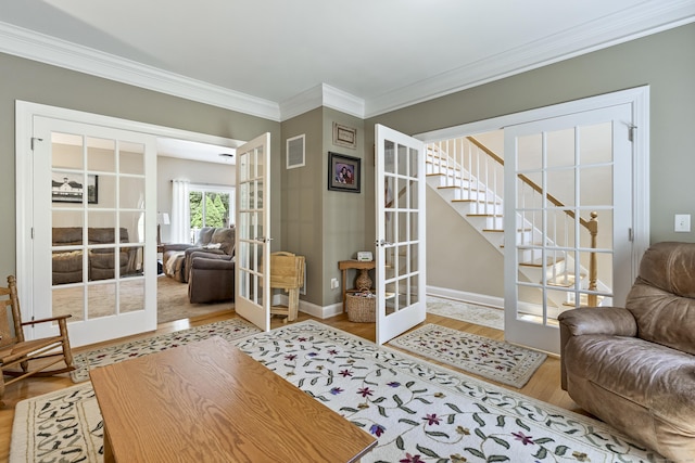 18 Jeans Ct, Woodstock, CT 06281 - living area featuring french doors, wood finished floors, crown molding, and stairs