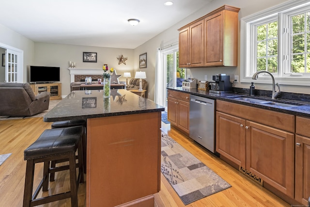 18 Jeans Ct, Woodstock, CT 06281 - kitchen featuring stainless steel dishwasher, light wood finished floors, open floor plan, a kitchen breakfast bar, and a kitchen island