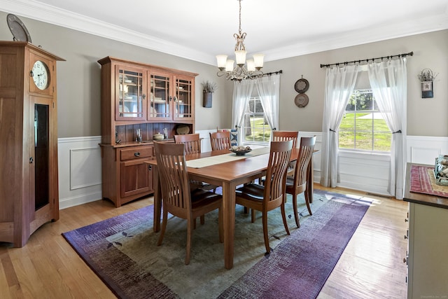 18 Jeans Ct, Woodstock, CT 06281 - dining space featuring a chandelier, a wainscoted wall, light wood-type flooring, a decorative wall, and crown molding