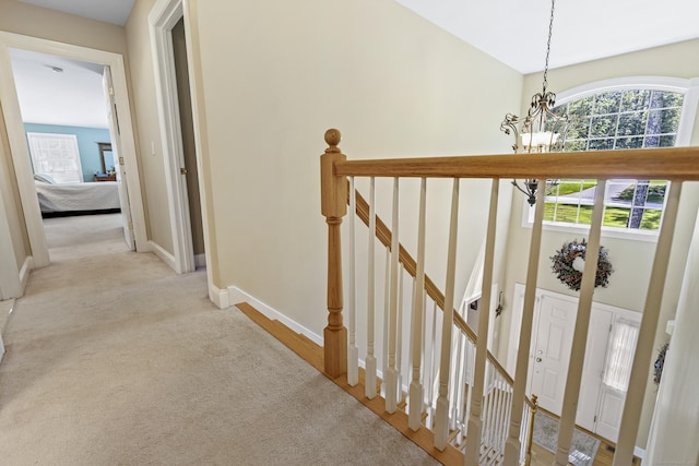 18 Jeans Ct, Woodstock, CT 06281 - corridor with a chandelier, an upstairs landing, and carpet floors