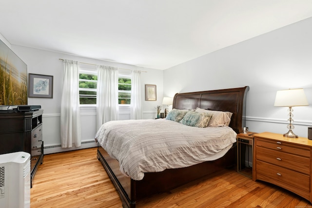 11 Old Kings Hwy, New Canaan, CT 06840 - bedroom featuring baseboard heating and light wood-type flooring