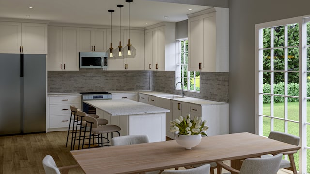 180 Bee St, Meriden, CT 06450 - kitchen with freestanding refrigerator, range, a center island, decorative backsplash, and recessed lighting
