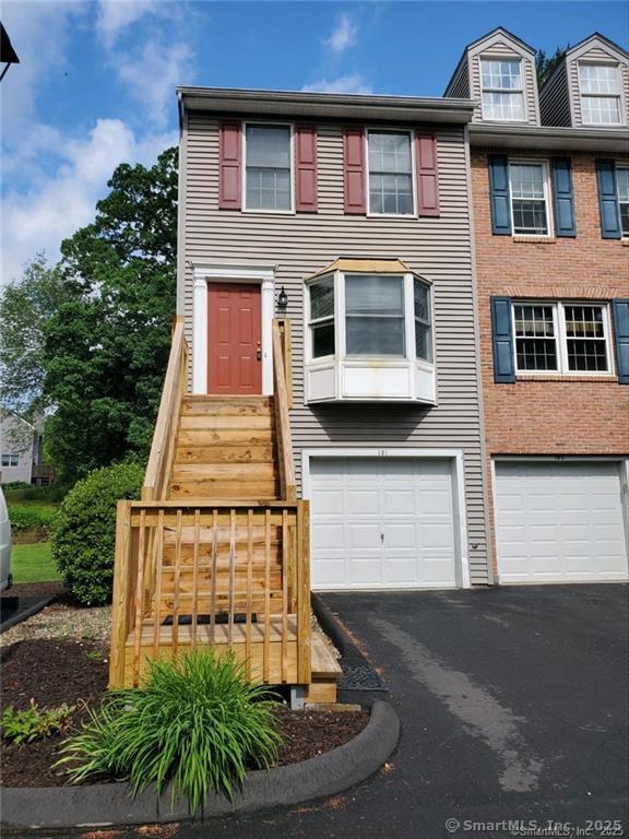 1275 Winsted Rd Unit 101, Torrington, CT 06790 - view of front of house with a garage and asphalt driveway