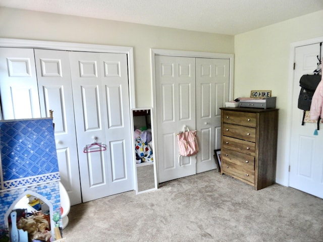 1275 Winsted Rd Unit 101, Torrington, CT 06790 - carpeted bedroom featuring multiple closets