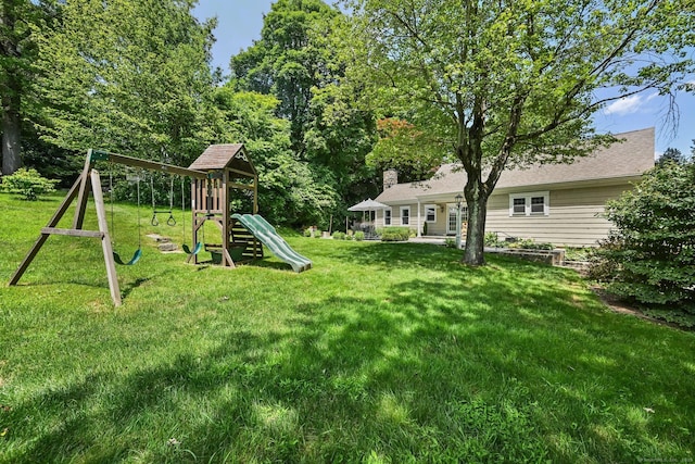 311 Wilton Rd E, Ridgefield, CT 06877 - view of green lawn featuring a playground