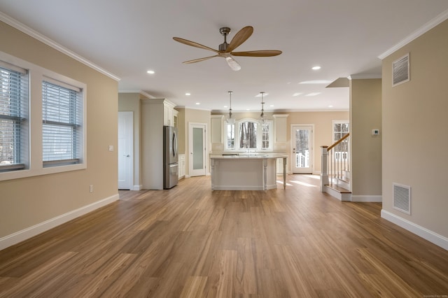 40 Allyn St, Groton, CT 06355 - living room with ceiling fan, light wood-style flooring, recessed lighting, ornamental molding, and stairway