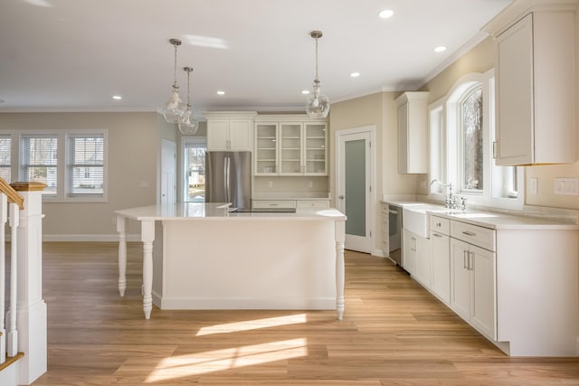40 Allyn St, Groton, CT 06355 - kitchen featuring appliances with stainless steel finishes, ornamental molding, a center island, light countertops, and recessed lighting