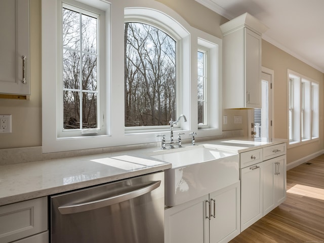 40 Allyn St, Groton, CT 06355 - kitchen featuring dishwasher, healthy amount of natural light, crown molding, light stone countertops, and light wood finished floors