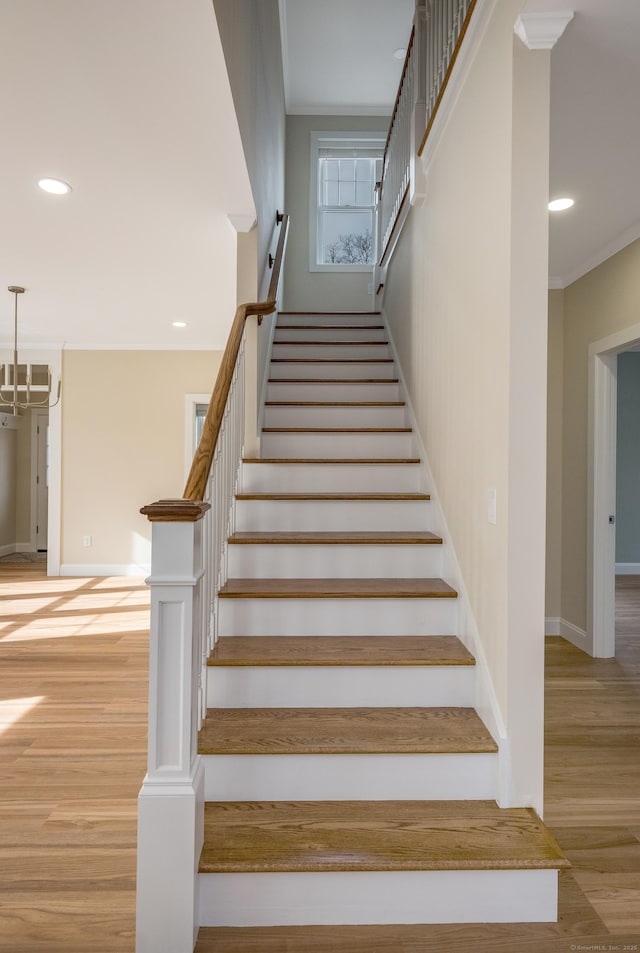 40 Allyn St, Groton, CT 06355 - stairs featuring wood finished floors, crown molding, and recessed lighting