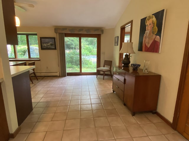31 Weiss Rd, Haddam, CT 06438 - living area featuring a baseboard heating unit, healthy amount of natural light, light tile patterned floors, lofted ceiling, and a ceiling fan