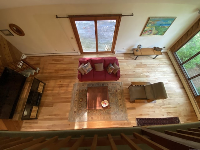 31 Weiss Rd, Haddam, CT 06438 - unfurnished living room featuring wood finished floors and baseboard heating