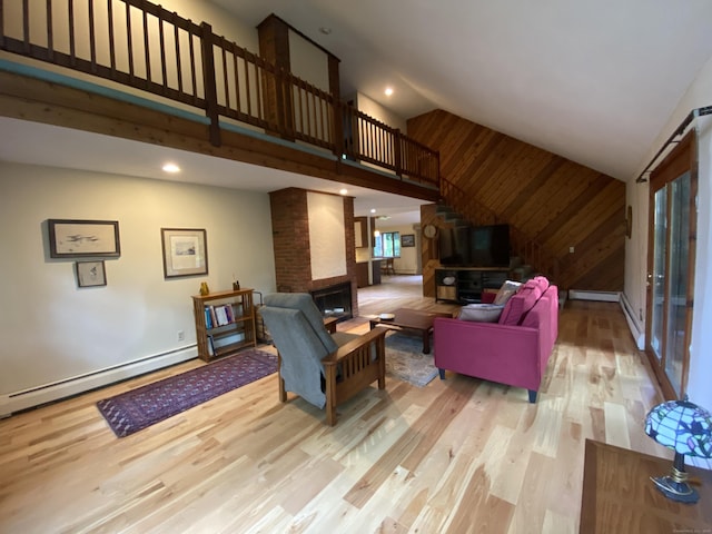 31 Weiss Rd, Haddam, CT 06438 - living area featuring a baseboard radiator, wood finished floors, high vaulted ceiling, a fireplace, and recessed lighting