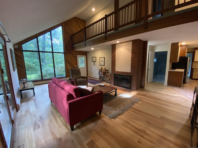 31 Weiss Rd, Haddam, CT 06438 - living room featuring high vaulted ceiling, a fireplace, light wood-style floors, recessed lighting, and baseboard heating