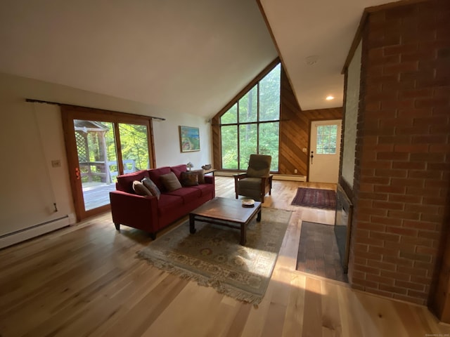 31 Weiss Rd, Haddam, CT 06438 - living room with wood finished floors, healthy amount of natural light, baseboard heating, vaulted ceiling, and wood walls