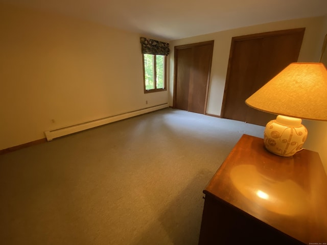 31 Weiss Rd, Haddam, CT 06438 - carpeted bedroom with a baseboard heating unit and multiple closets