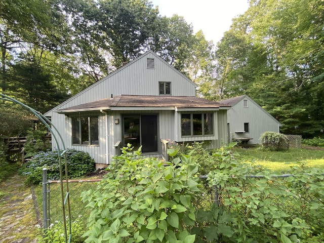 31 Weiss Rd, Haddam, CT 06438 - rear view of property with roof with shingles and view of wooded area
