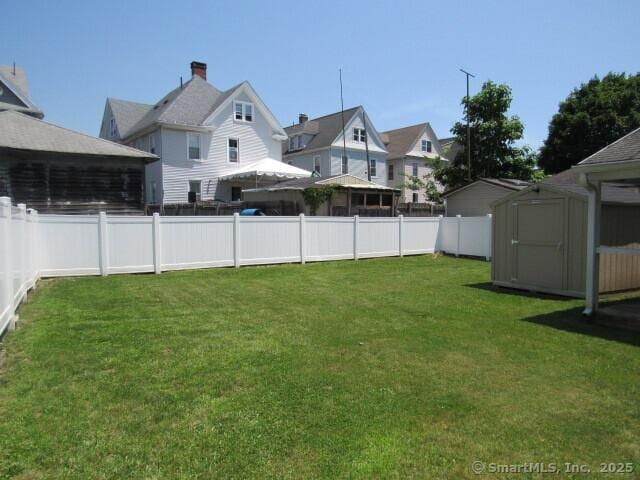 76 Porter St, Bridgeport, CT 06606 - fenced backyard with a shed and a residential view