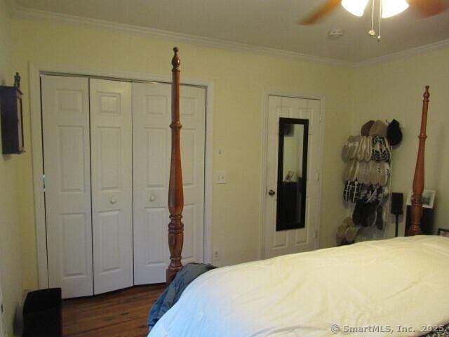 76 Porter St, Bridgeport, CT 06606 - bedroom featuring dark wood-style flooring, ornamental molding, a ceiling fan, and a closet