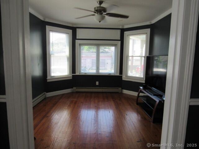 76 Porter St, Bridgeport, CT 06606 - unfurnished sunroom featuring a baseboard radiator and a baseboard heating unit