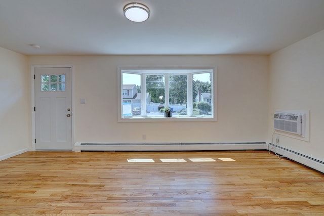 6 Overbrook Dr, East Hartford, CT 06118 - entryway with light wood-style flooring, a baseboard heating unit, and an AC wall unit