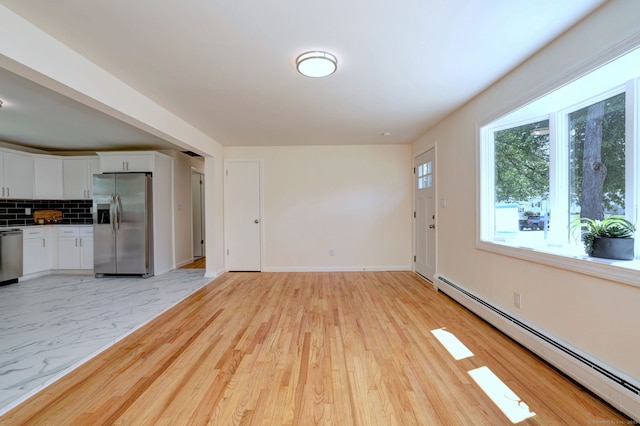 6 Overbrook Dr, East Hartford, CT 06118 - unfurnished living room featuring a baseboard heating unit and light wood-type flooring