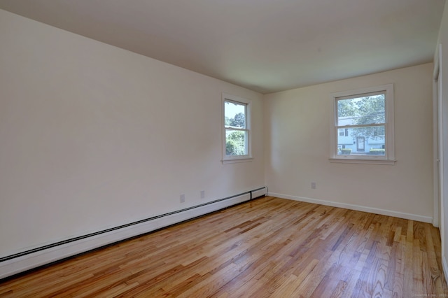 6 Overbrook Dr, East Hartford, CT 06118 - spare room featuring a baseboard heating unit and light wood finished floors
