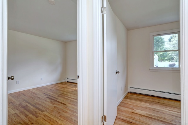6 Overbrook Dr, East Hartford, CT 06118 - spare room with a baseboard heating unit and wood finished floors