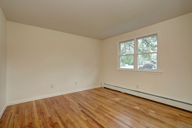 6 Overbrook Dr, East Hartford, CT 06118 - empty room with baseboard heating and light wood-type flooring