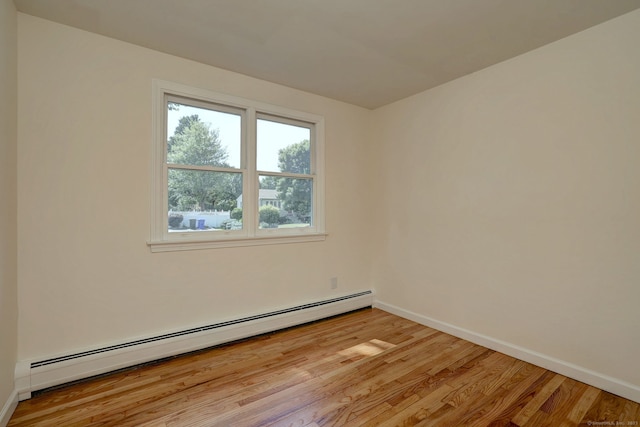 6 Overbrook Dr, East Hartford, CT 06118 - empty room with a baseboard radiator and light wood finished floors