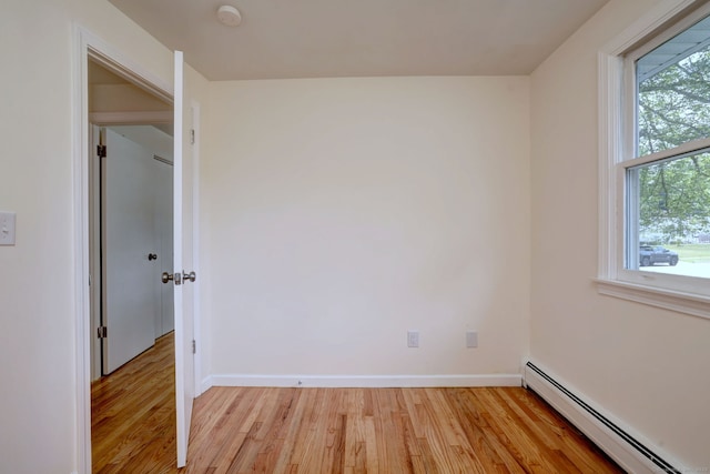 6 Overbrook Dr, East Hartford, CT 06118 - unfurnished room featuring a baseboard heating unit, a smoke detector, and light wood finished floors