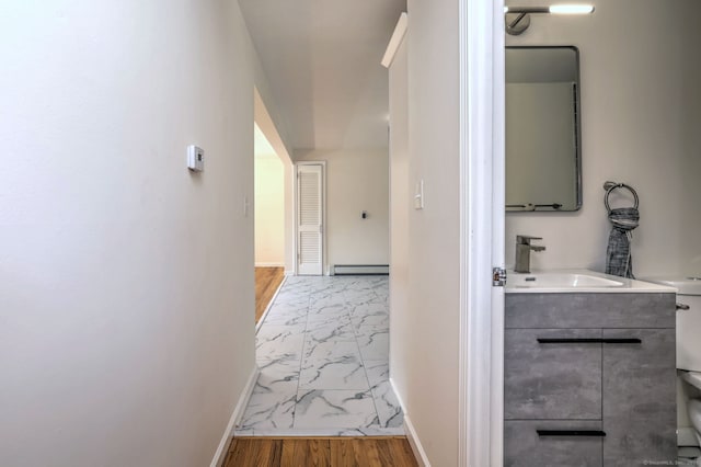 6 Overbrook Dr, East Hartford, CT 06118 - hall with marble look tile flooring and a baseboard heating unit