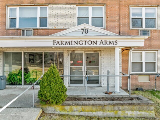 70 Farmington Ave Unit 1V, New London, CT 06320 - doorway to property featuring brick siding