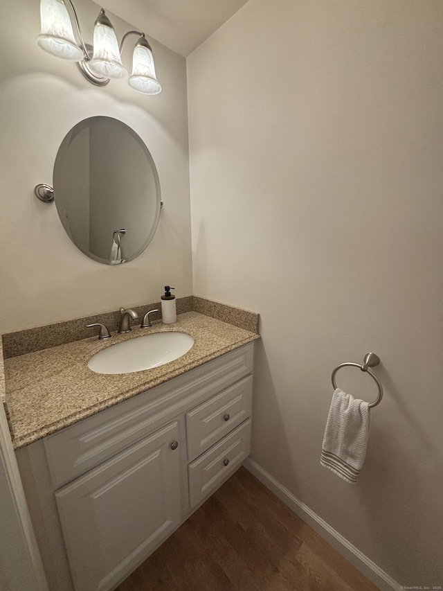 22 Wishing Well Ln Unit 22, New Milford, CT 06776 - bathroom featuring vanity and wood finished floors