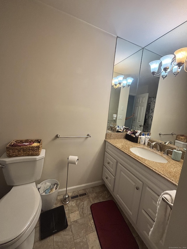 22 Wishing Well Ln Unit 22, New Milford, CT 06776 - bathroom featuring vanity, stone finish flooring, and a chandelier