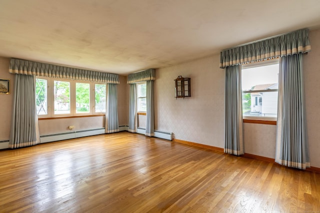 39 George Rd, Windsor Locks, CT 06096 - spare room featuring wood finished floors and a baseboard radiator