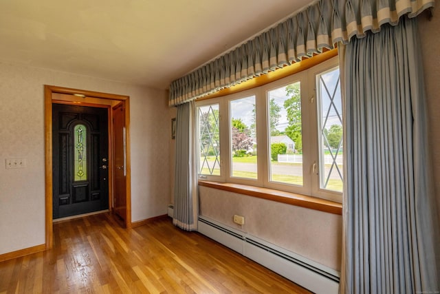 39 George Rd, Windsor Locks, CT 06096 - foyer entrance with a baseboard radiator and wood finished floors