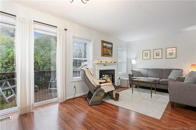 1802 Larson Dr Unit 1802, Danbury, CT 06810 - living area featuring wood finished floors and a lit fireplace