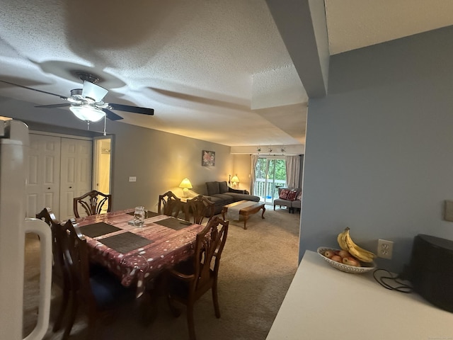 711 Twin Circle Dr Unit 711, South Windsor, CT 06074 - dining area featuring carpet, a textured ceiling, and a ceiling fan