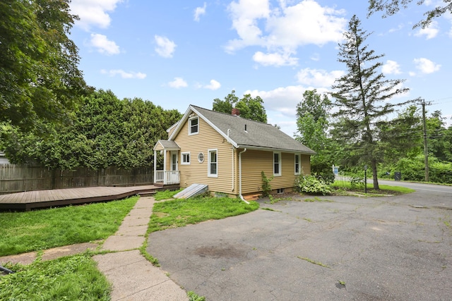 159 Bolton Rd, Vernon, CT 06066 - back of property featuring a chimney, a deck, and a shingled roof