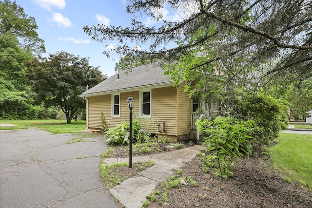 159 Bolton Rd, Vernon, CT 06066 - view of front facade with a front yard and a shingled roof