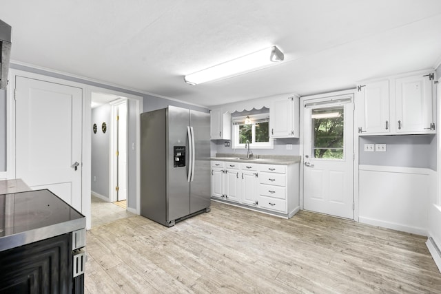 159 Bolton Rd, Vernon, CT 06066 - kitchen featuring stainless steel fridge with ice dispenser, light wood-type flooring, light countertops, and white cabinets