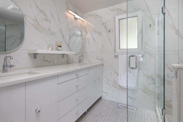 35 Emmons Ln, North Canaan, CT 06018 - full bath featuring double vanity, tile walls, and a marble finish shower