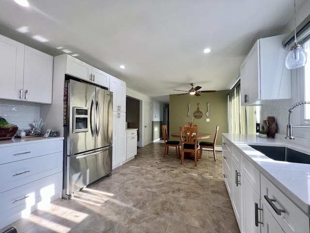 65 Patchen St, Stratford, CT 06615 - kitchen with stainless steel refrigerator with ice dispenser, ceiling fan, tasteful backsplash, white cabinets, and recessed lighting