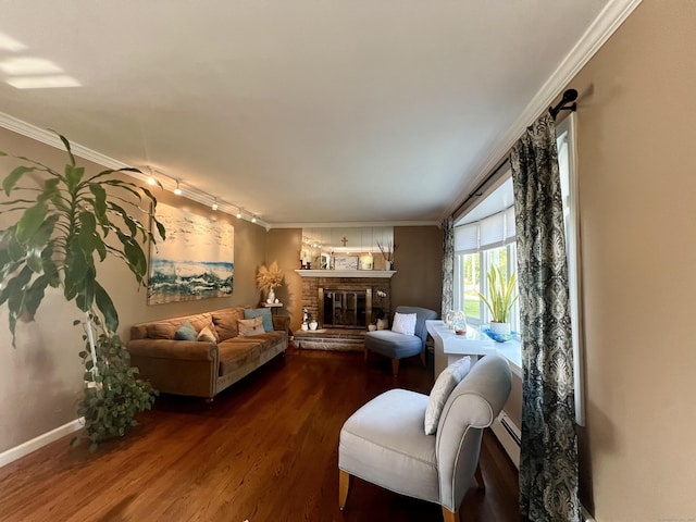 65 Patchen St, Stratford, CT 06615 - living room with crown molding, dark wood-style flooring, baseboard heating, and a glass covered fireplace