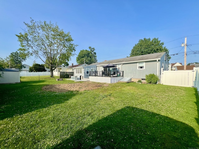 65 Patchen St, Stratford, CT 06615 - back of house with a fenced backyard and an outdoor structure