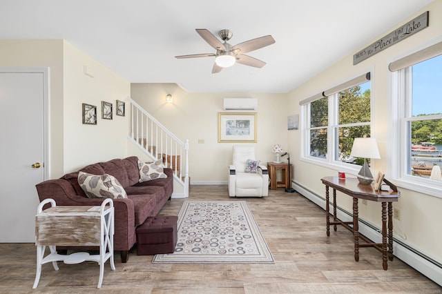 138 S Shore Rd, Killingly, CT 06241 - living area with a wall mounted AC, stairs, wood finished floors, and plenty of natural light